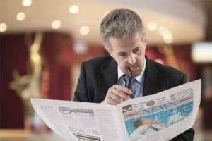 Business man reading a newspape